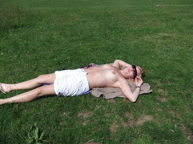 Photo by Nipple1 with the username @Nipple1, who is a verified user,  April 11, 2022 at 11:10 AM and the text says 'sun bathing in the park'