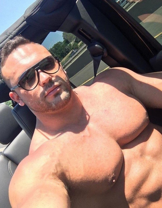 Photo by HOT RIDES-HOT GUYS! with the username @hotrides-hotguys,  March 21, 2021 at 6:18 PM. The post is about the topic Hot Rides-Hot Guys!!! and the text says 'He opened up the overhead roof not only to get some nice breezes, but to get some hot sun on those mega pecs. Do you like how these muscles ride?'