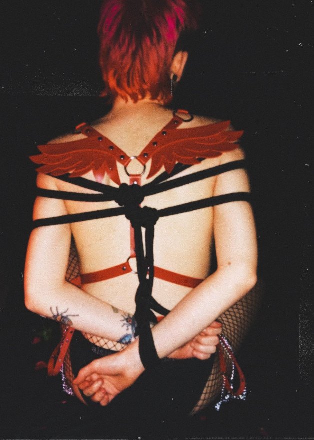 Photo by trophytheythem with the username @trophytheythem,  February 16, 2021 at 2:52 PM. The post is about the topic Non-Binary Exhibition and the text says 'my first time getting tied up for the camera ❣️'