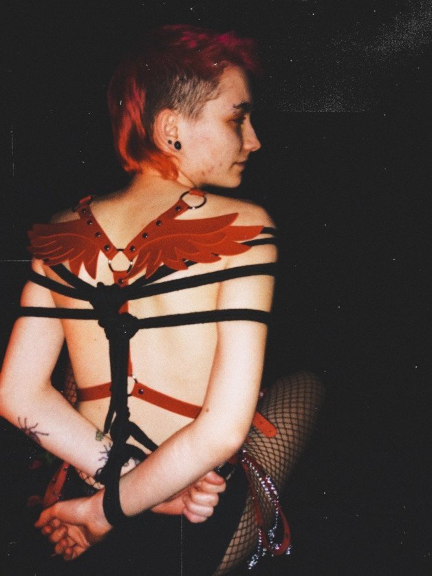 Photo by trophytheythem with the username @trophytheythem,  February 16, 2021 at 2:52 PM. The post is about the topic Non-Binary Exhibition and the text says 'my first time getting tied up for the camera ❣️'