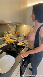 Photo by Bikini Fanatics with the username @BikiniFanatics, who is a verified user,  August 19, 2021 at 3:01 PM. The post is about the topic Ladies cooking and dining and the text says 'Want me to make you dinner?'